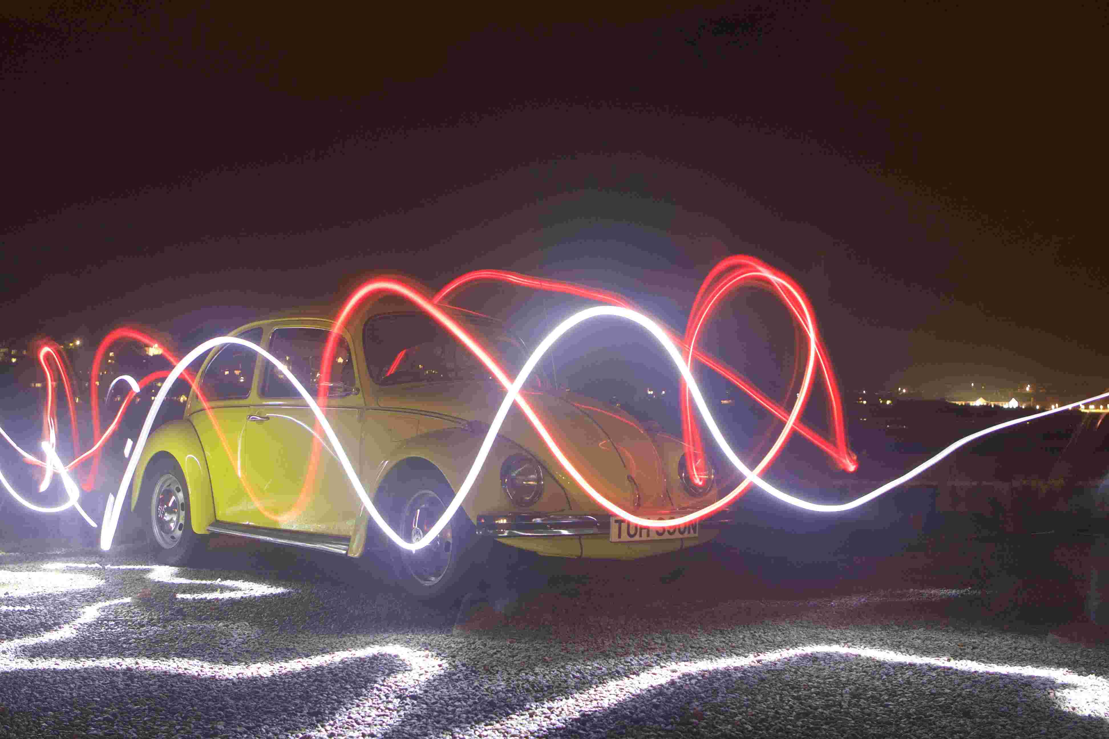 Light trails in front of Volkswagen Beetle